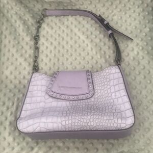 French Connection pretty lavender shade of handbag made of vinyl chloride.